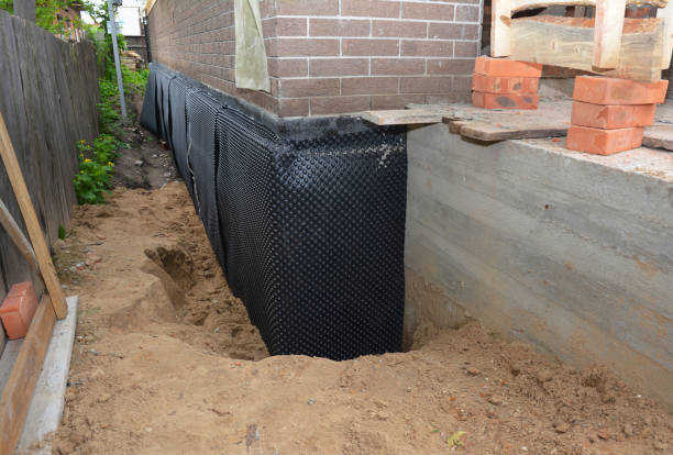 Happy homeowners after waterproofing job in Swayzee